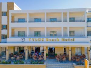 a hotel with a sign that reads tysos beach hotel at Tylos Beach Hotel in Kato Pyrgos