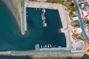 an overhead view of a harbor with boats in it at Tylos Beach Hotel in Kato Pyrgos