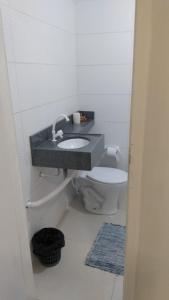 a bathroom with a sink and a toilet at Casa Condomínio Beira Rio in Canindé de São Francisco