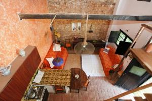 an overhead view of a living room with orange furniture at Casa Grande Portugal in Burgau