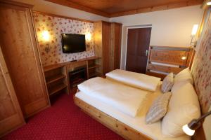 Rúm í herbergi á Hotel Metzgerwirt