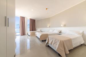 Postel nebo postele na pokoji v ubytování Smart Hotel Ugento