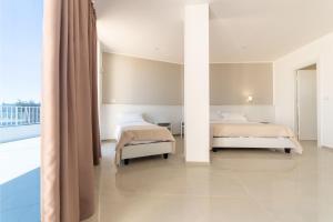 Postel nebo postele na pokoji v ubytování Smart Hotel Ugento