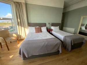Postel nebo postele na pokoji v ubytování Rolling Wave Guesthouse