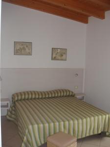 Postel nebo postele na pokoji v ubytování Residence Candeloro