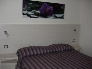 Postel nebo postele na pokoji v ubytování Residence Candeloro