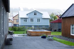 a house with a swimming pool in a yard at Hotel Siglunes in Siglufjörður