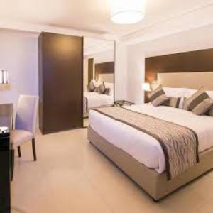 En eller flere senge i et værelse på Room in Guest room - Dilida Guest Suites-standard