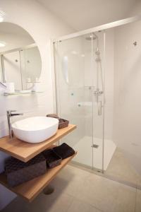 a bathroom with a sink and a shower at Apartment El Sueño - GREAT SEA VIEWS - SWIMMING POOL - free Wifi- smart TV-Residence SENATOR el majo in Costa Teguise