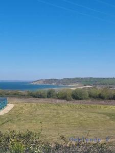 a view of a large body of water at Modern Sea View Holiday Home Isle of Wight in Porchfield