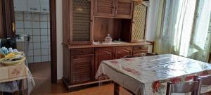 a kitchen with a sink and a table with a mirror at Maranzano 90 in Città della Pieve