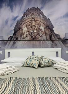เตียงในห้องที่ Suite del Ponte Normanno Vespro