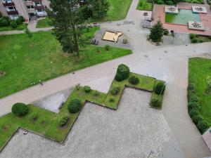 an aerial view of a park with grass and bushes at Bergstation Altenau in Altenau +4 photos