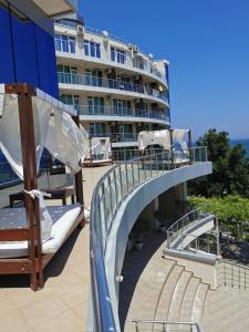 a balcony of a hotel with beds and a bridge at Silver A 27 in Byala