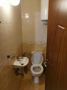 a bathroom with a toilet and a sink at Silver A 27 in Byala +26 photos