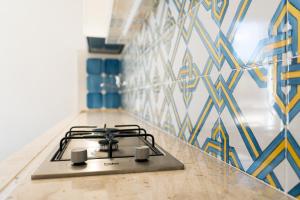 A kitchen or kitchenette at Albarìa Favignana Apartments