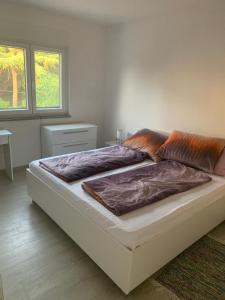 a large bed in a room with at Galeb Apartments osjecka ulica 37 in Pula