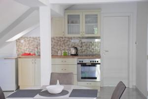 a kitchen with a table with a bowl on it at Villa Bella in Golubac