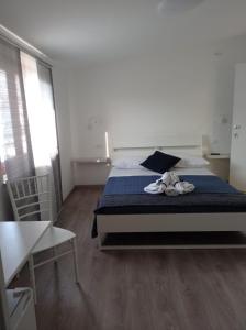 Een bed of bedden in een kamer bij Bouganville da Giò