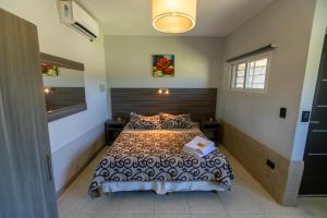 Postel nebo postele na pokoji v ubytování Cabañas y Habitaciones Terra Nostra Complejo