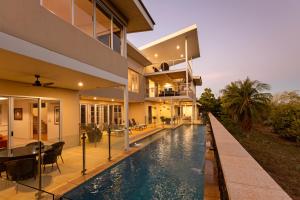 an external view of a house with a swimming pool at Koolinda by the Bay, Broome WA in Broome