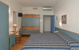 Postel nebo postele na pokoji v ubytování Hotel Apuana
