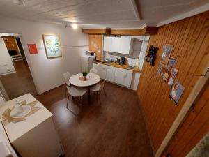 an overhead view of a kitchen with a table at Basement Apartment in Cologne