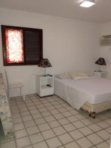 Ένα ή περισσότερα κρεβάτια σε δωμάτιο στο Flat no hotel fazenda portal de Gravatá