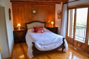 מיטה או מיטות בחדר ב-Casa del Río