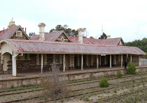 an old train station with a red roof at Burra Railway Station BnB in Burra