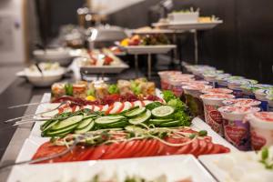 a buffet line with many different types of food at Hotel Alexander in Krakow