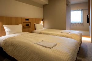 Postel nebo postele na pokoji v ubytování Nesthotel alt Kuramae Station + 12 fotografií