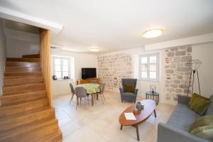 a living room with a couch and a table at Katareo Apartments in Kotor