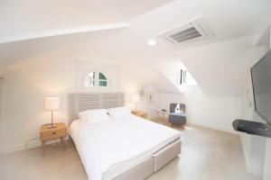 Katil atau katil-katil dalam bilik di Katareo Apartments
