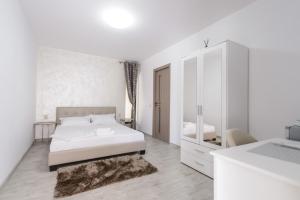 Postel nebo postele na pokoji v ubytování Toma Residence