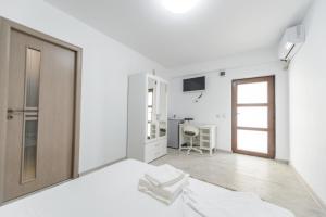 Postel nebo postele na pokoji v ubytování Toma Residence