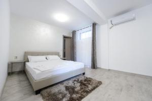 Postel nebo postele na pokoji v ubytování Toma Residence