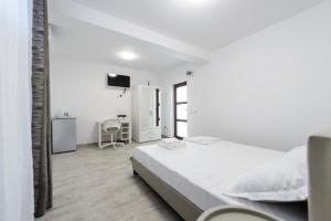 Postel nebo postele na pokoji v ubytování Toma Residence