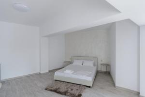 Postel nebo postele na pokoji v ubytování Toma Residence