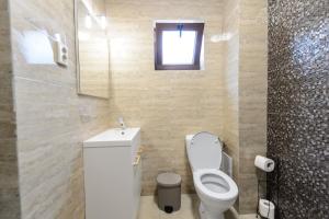 Koupelna v ubytování Toma Residence