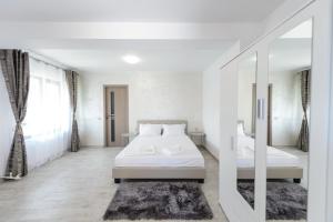 Postel nebo postele na pokoji v ubytování Toma Residence