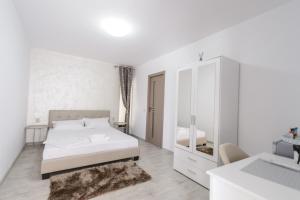 Postel nebo postele na pokoji v ubytování Toma Residence