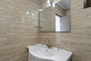 Koupelna v ubytování Toma Residence