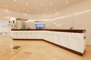 Лобби или стойка регистрации в Soothe Hotel +37 фотографий