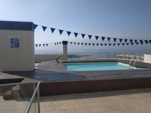 a swimming pool on top of a building at Apartamento Numi II in L'Ametlla de Mar