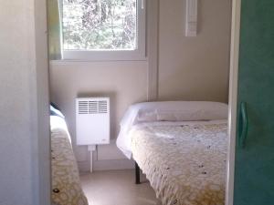 Postel nebo postele na pokoji v ubytování Camping Cobijo
