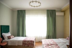 Postel nebo postele na pokoji v ubytování Phazisi Hotel + 23 fotografií