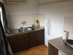 a kitchen with a sink and a counter top at Ritual Greece Appartement 2 in Kypséli