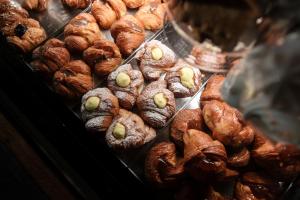 a display of pastries and croissants in a bakery at Residence Mariavittoria in Lido di Jesolo