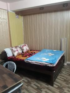 Postel nebo postele na pokoji v ubytování Smriya Homestay